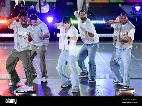 South Korean singer Jung Kook, center, from the K-pop band BTS performs ...