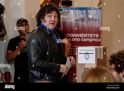 Argentina. 22nd Oct, 2023. Javier Milei holds a ballot paper at a polling station during the ...