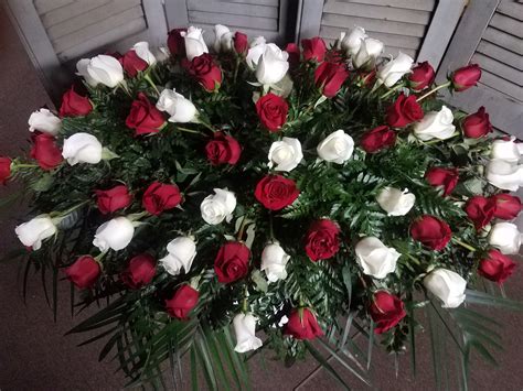 Red and white casket spray in roses in Columbia, PA | Flowers by US