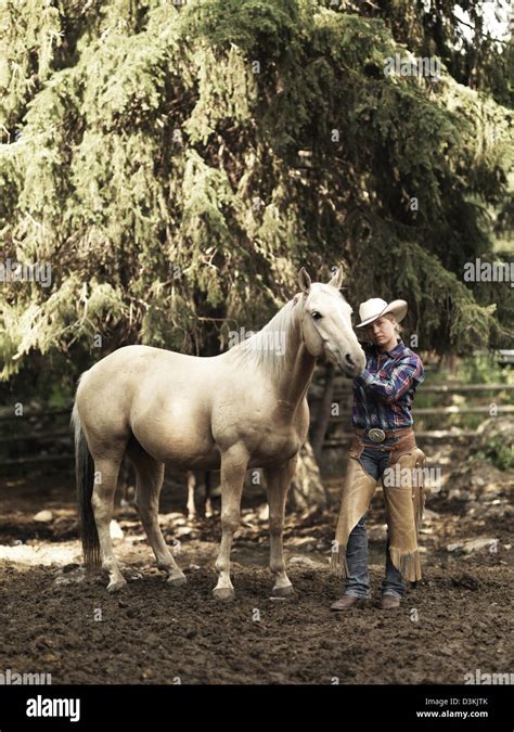 Cowgirl with horse on ranch in Montana, USA Stock Photo - Alamy