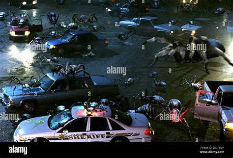 GIANT SPIDERS IN CAR PARK, EIGHT LEGGED FREAKS, 2002 Stock Photo - Alamy