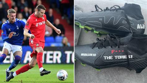 Wrexham Paul Mullin has 'F**k the Tories' printed on the side of his boots