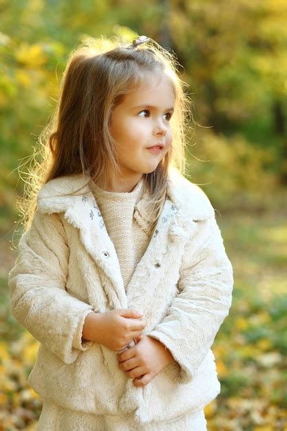 Premium Photo | Girl walks through the autumn forest