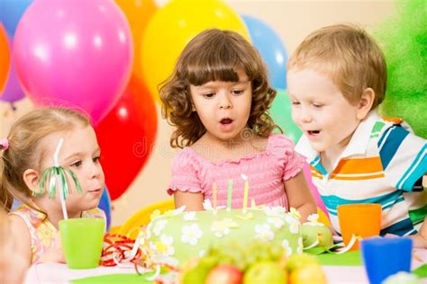 Kids Celebrate Birthday Party Blowing Candles Stock Photo - Image of gift, festive: 26933076