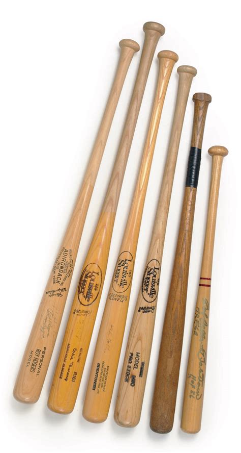 A COLLECTION OF SIGNED BASEBALL BATS