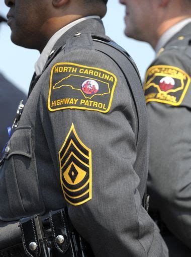 North Carolina Highway Patrol troopers wait to enter Police Badge ...