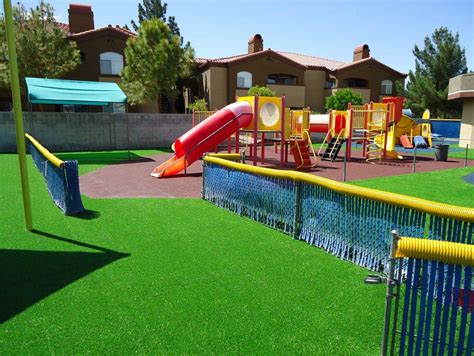 This daycare choose to use synthetic turf and a permeable solid rubber surface around their ...