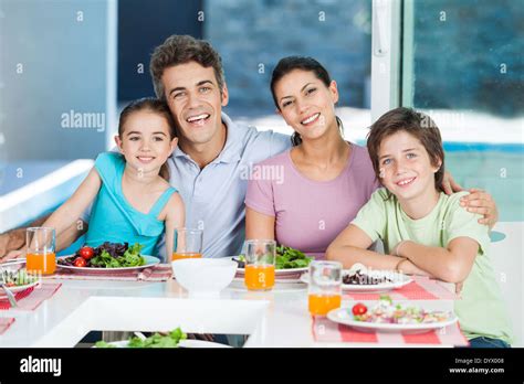 Family in big house Stock Photo - Alamy