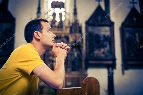 Man praying in a church — Stock Photo © lightpoet #61564327