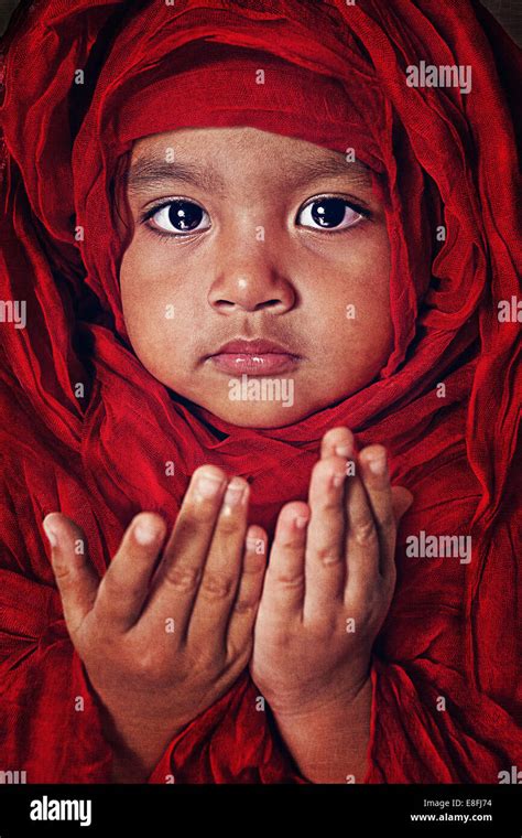 Portrait of a girl praying Stock Photo - Alamy