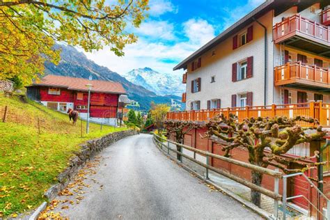 Fantastic Autumn View of Traditional Swiss Chalets in Wengen Village ...