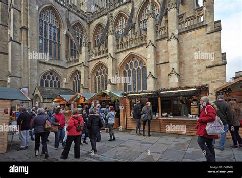 Bath Christmas market traditional wooden chalets in Bath Abbey Abbey Churchyard Stock Photo - Alamy