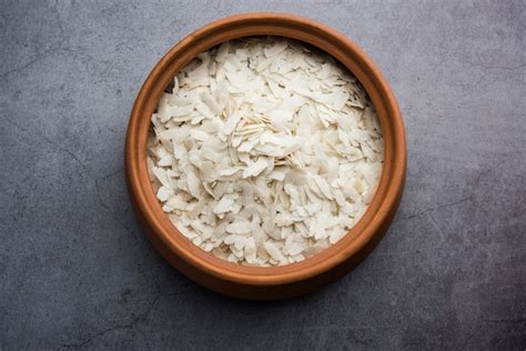 Premium Photo | Raw Flattened Rice or Thick or thin Rice Flakes for ...