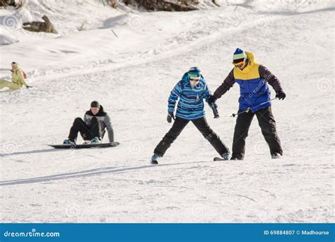 The Instructor Teaches How To Ski on Snow Downhill Ski Training on the ...