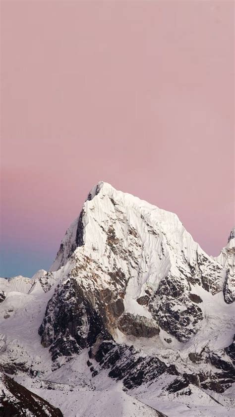 Snow Covered Mountains under a Pink Sky