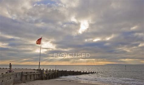 Sunset scene with sun beams over smooth sea — warm, seascape - Stock Photo | #147849763