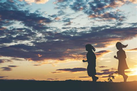 Sunset silhouette of children playing 1978102 Stock Photo at Vecteezy