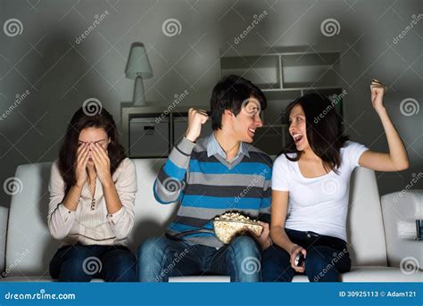 Group of Young People Watching TV on the Couch Stock Image - Image of interior, audience: 30925113