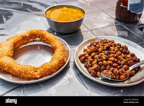 Nepalese food breakfast with Sel Roti and chickpeas. Ring Road in Kathmandu, Nepal Stock Photo ...