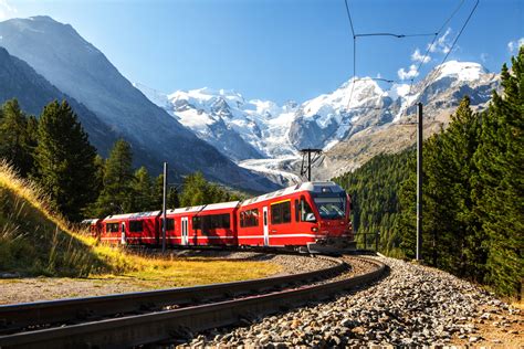 Swiss train in the Alps mountains in Switzerland - Pure Vacations