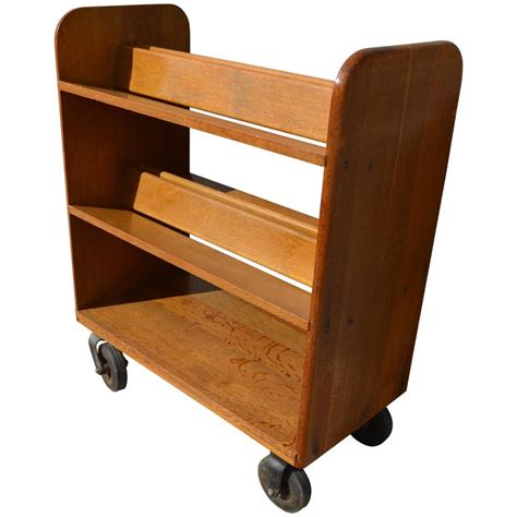 Midcentury Oak Book Cart with slanted Shelves on Wheels from Public Library at 1stDibs