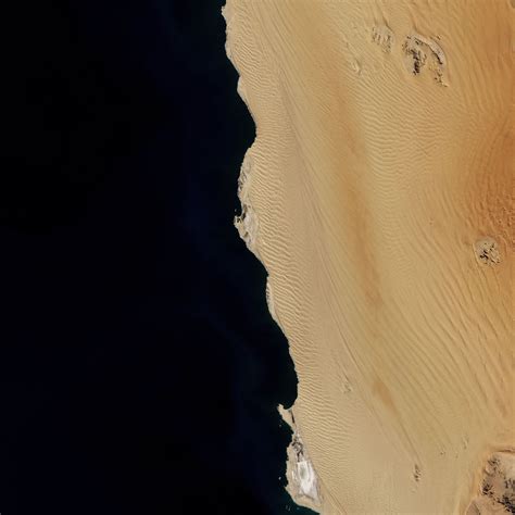 Sand dunes in Namib-Naukluft National Park on the coast of Namibia. Picture acquired by ...