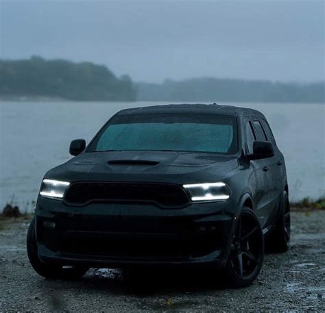 Black Dodge SUV by the Water