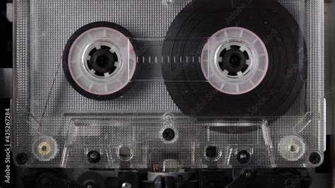 Close-up A tape recorder is playing an audio cassette. Close-up. A ...