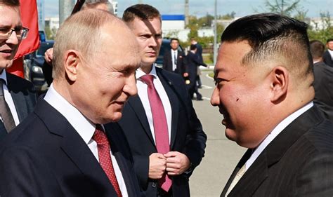 Putin gives Kim Jong Un 'bonecrusher' handshake as North Korean leader ...