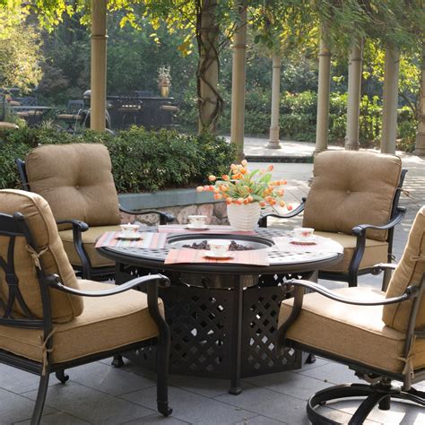 Exterior: Black Wicker Armchairs With Striped Cushions And Round Costco Fire Pit On Wooden Flo ...