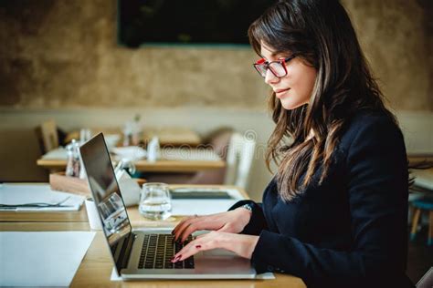 Happy Girl Typing on Computer in Restaurant Stock Image - Image of lifestyle, internet: 107900335