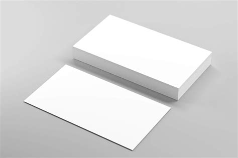 two white business cards sitting on top of each other