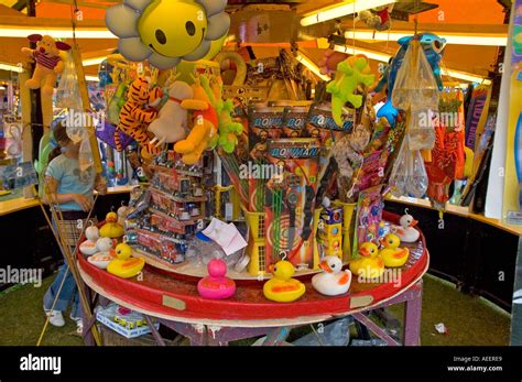 Hook a duck fairground stall with prizes including toys and goldfish Stock Photo - Alamy