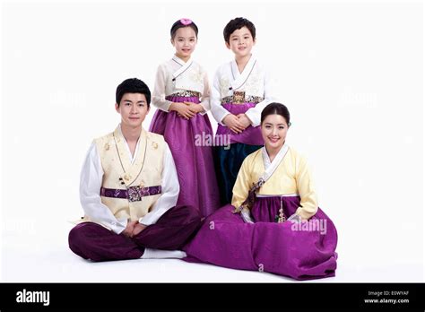 a family wearing traditional Korean outfits Stock Photo - Alamy