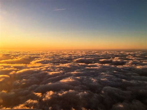 Sunrise Over The Clouds At 30,000 Feet