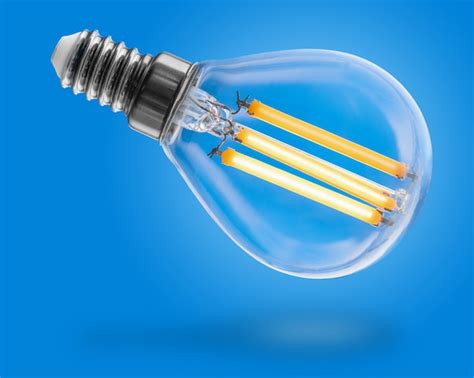 Premium Photo | Energy efficient led filament light bulb glowing isolated