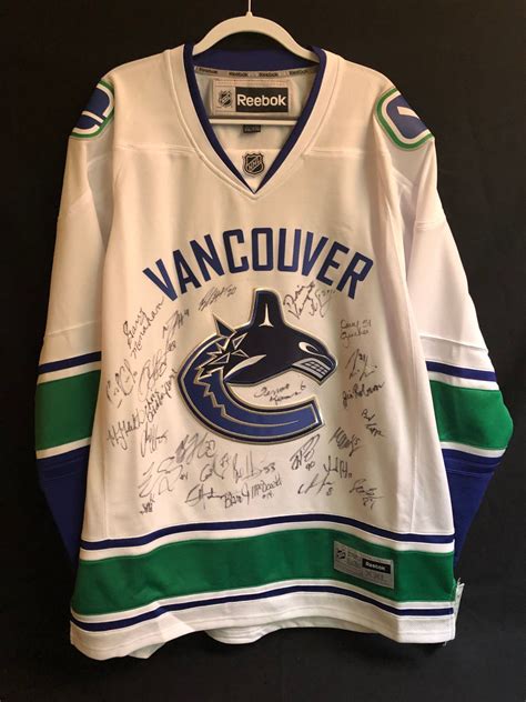 VANCOUVER CANUCKS MULTI SIGNED HOCKEY JERSEY (TROY STECHER/ JIM ROBSON ...