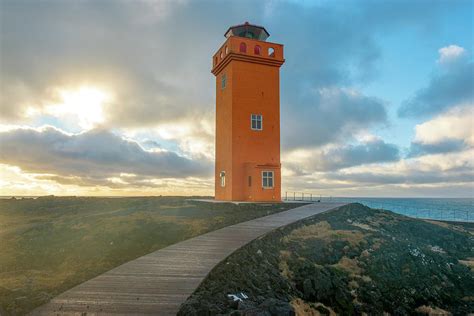 Svoertuloft Orange Lighthouse, Iceland Photograph by Dubi Roman - Pixels