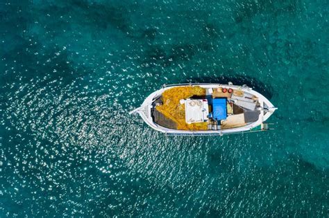 Aerial Photo Top View of Small Traditional Fishing Boat in Tropical ...