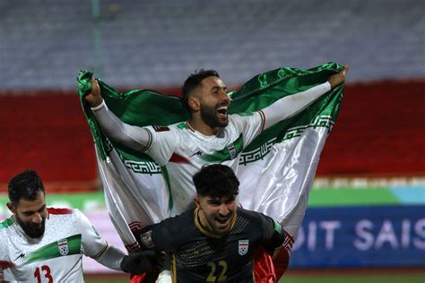 Download Iran National Football Team Players With Flag Wallpaper | Wallpapers.com