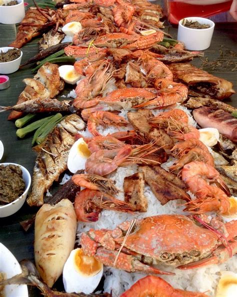 Seafood Boodle Fight (Philippines) No dinner ware or cutlery needed. Eat with bear hands on a ...