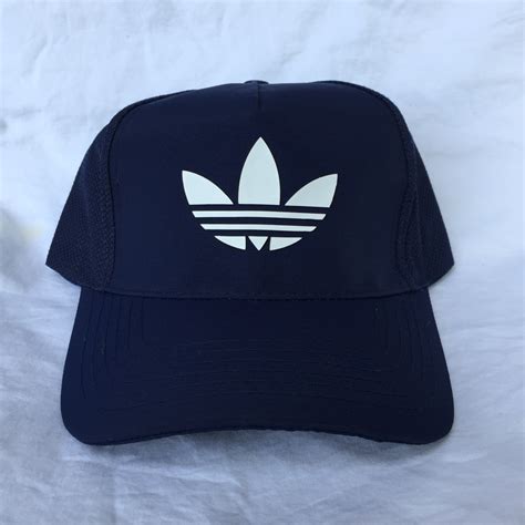 Adidas flower logo, Men's Fashion, Watches & Accessories, Caps & Hats on Carousell