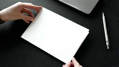 Person Holding White Printer Paper · Free Stock Photo