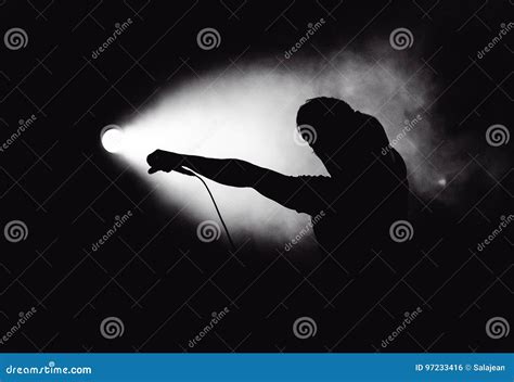 Silhouette of an Artist in Stage Lights Stock Photo - Image of light, heavy: 97233416