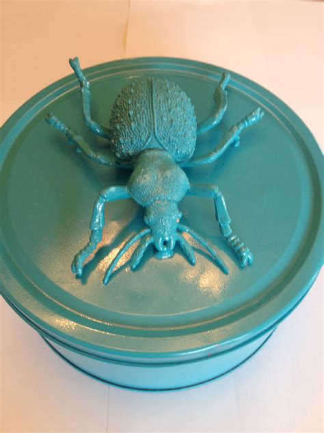 Tiffany blue bug - made from a tin cookie container, plastic bug, spray paint...fun place to put ...