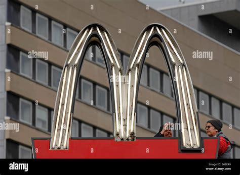 Mc Donalds neon sign gets repaired Stock Photo - Alamy