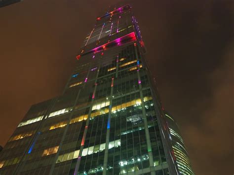 Premium Photo | The shard building is lit up at night.