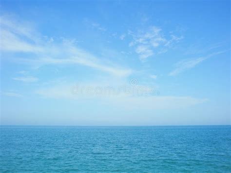 Blue sea and sky horizon with clouds. Plain sea and sky horizon in ...