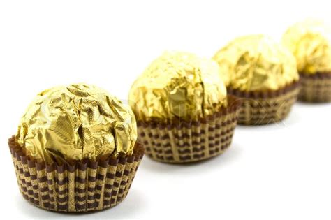 Gold chocolate balls on white | Stock image | Colourbox