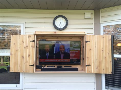 Outdoor TV cabinet made of cedar. | Outdoor tv cabinet, Apartment patio decor, Outdoor cabinet diy